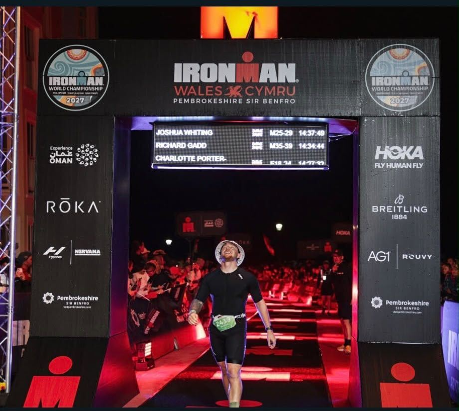 Josh crossing an endurance race finish line